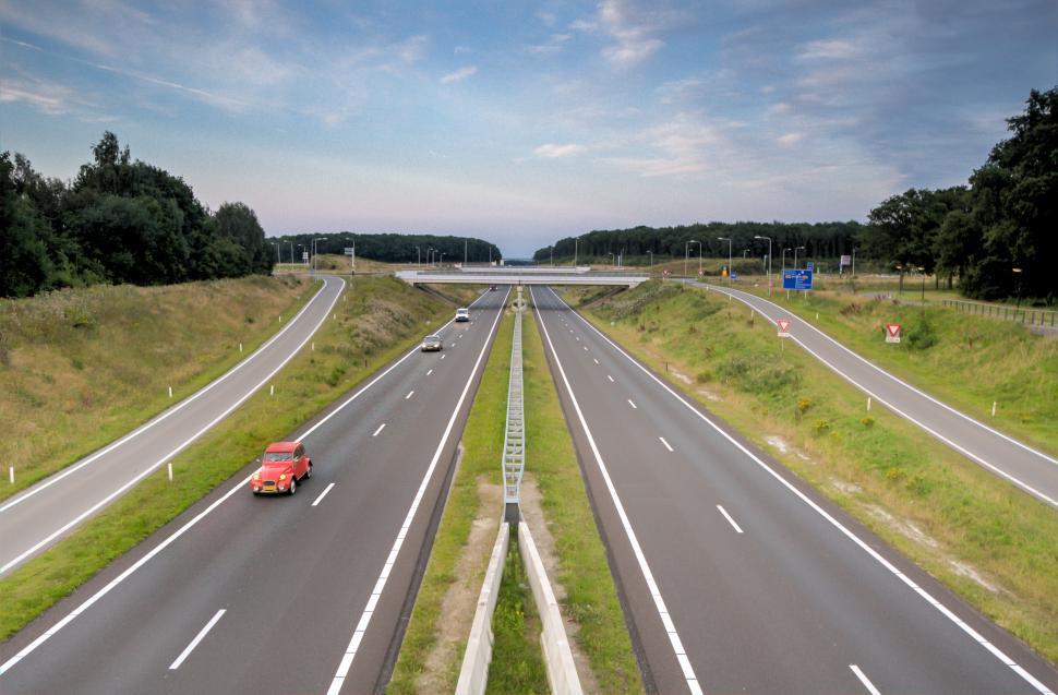 Free Image of Aerial View of Highway With Red Truck 
