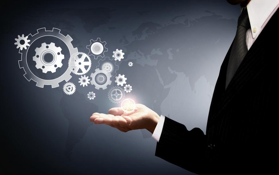 Free Image of Businessman Holding Virtual Cogwheels - Business and Work 