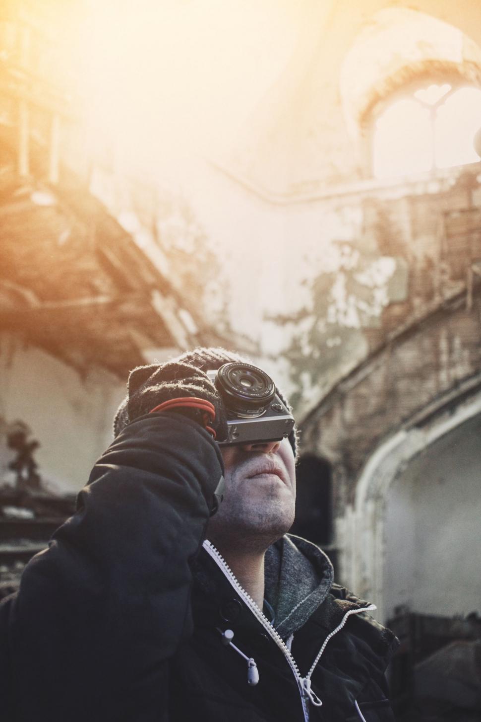 Free Image of Man Taking a Picture With a Camera 