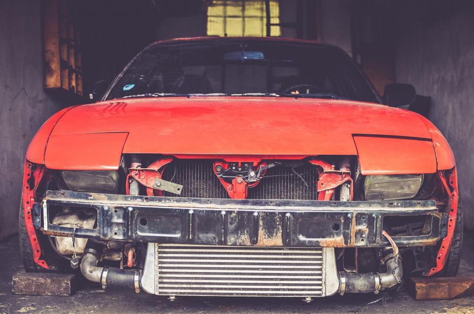 Free Image of Front View of Red Car in Garage 
