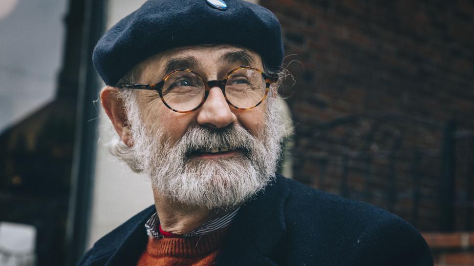 Free Image of Old Man With White Beard Wearing Hat and Glasses 
