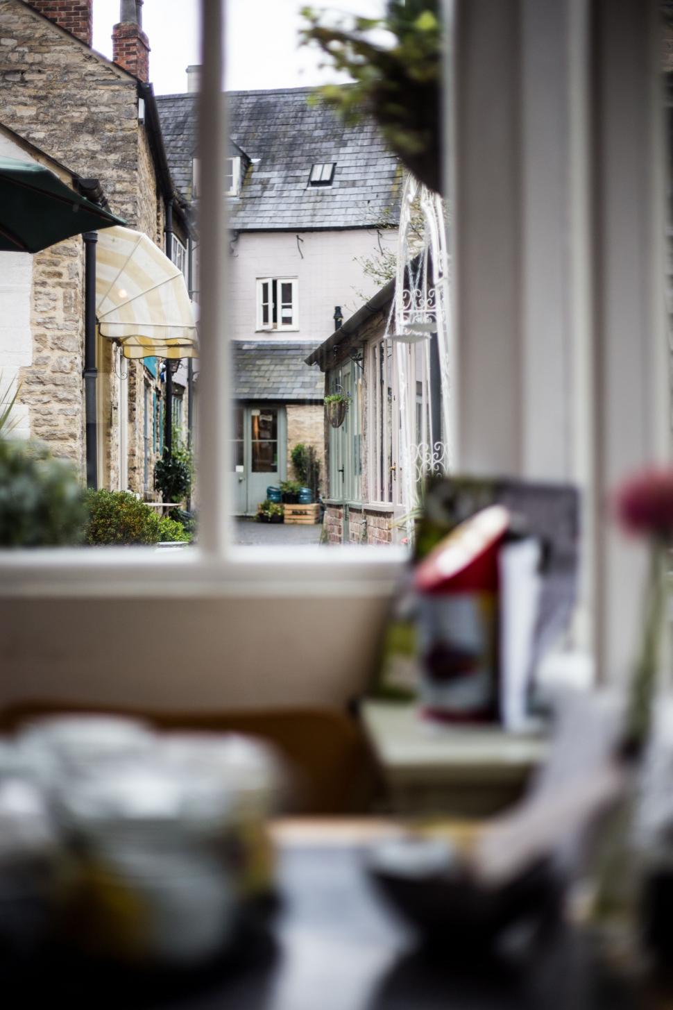 Free Image of Looking Out a Window at a House 