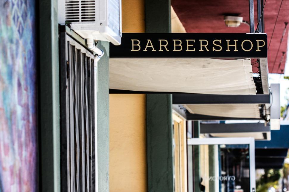 Free Image of Street Sign Hanging From Side of Building 