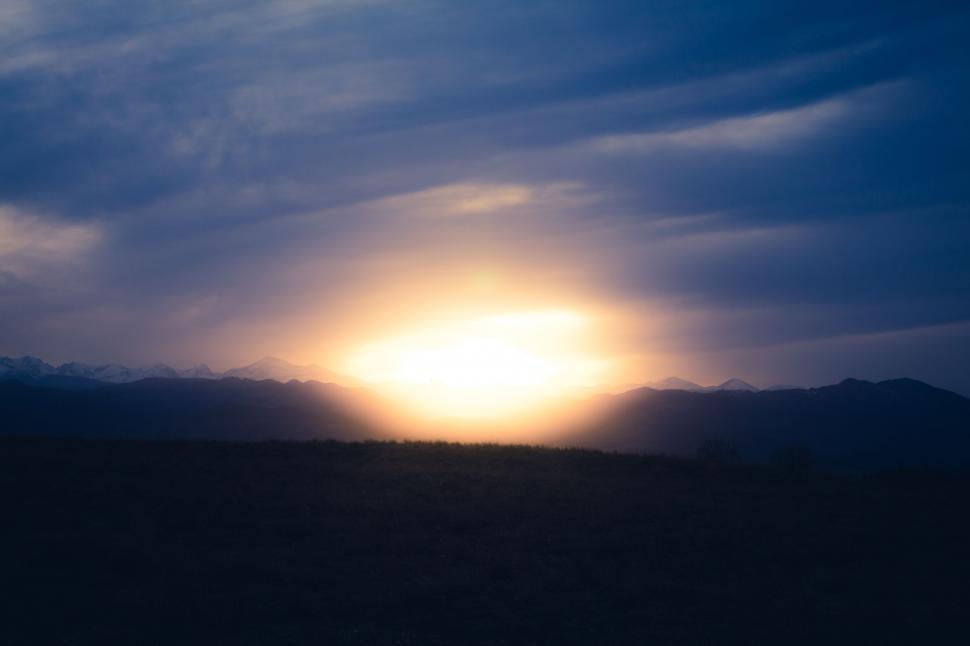Free Image of Sun Setting Over Mountain Range 