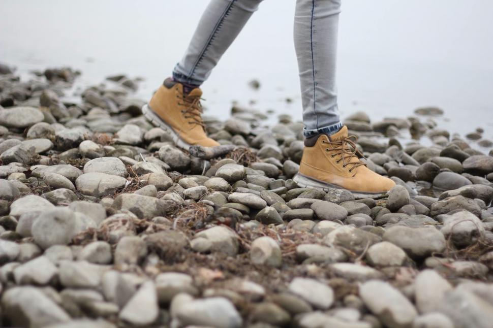 Free Image of Person Standing on Pile of Rocks 