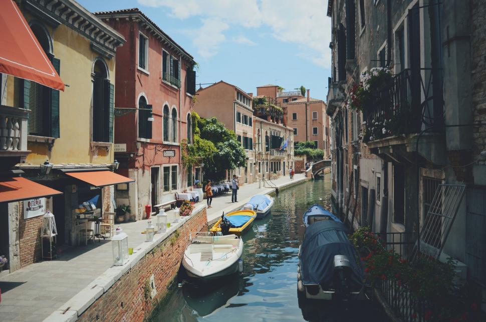 Free Image of Boats Parked Along a Canal 