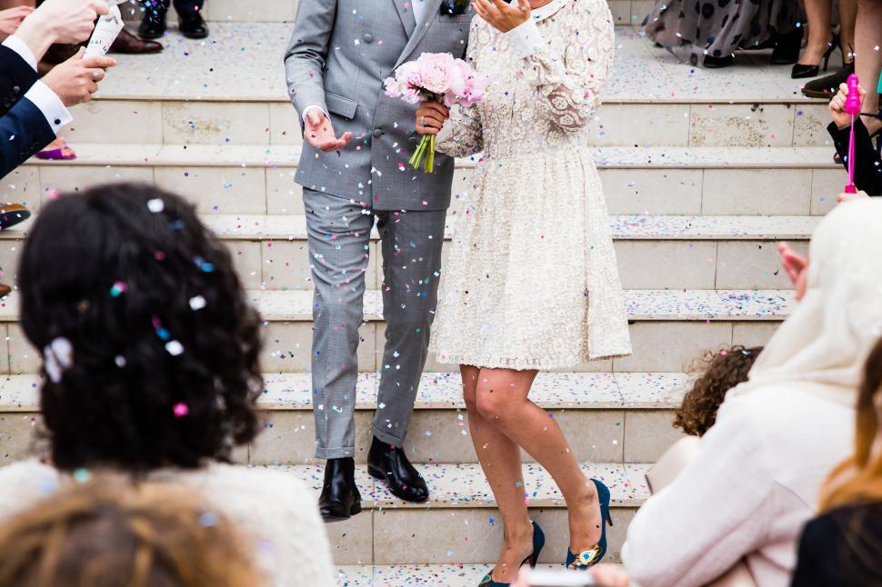 Free Image of A Man and a Woman Standing on the Steps 
