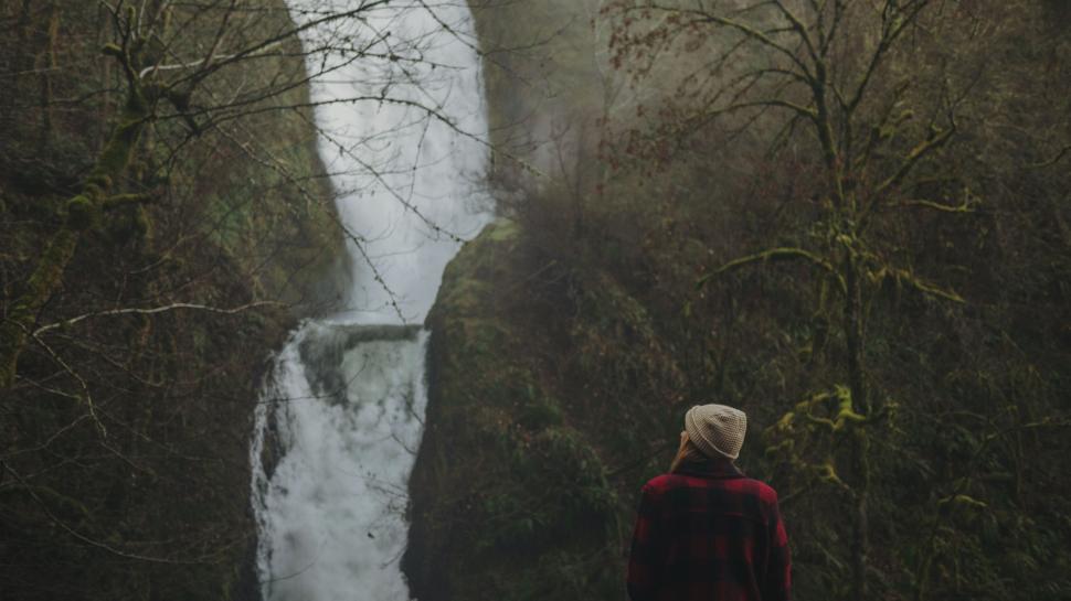 Free Image of Person Standing in Front of Waterfall 