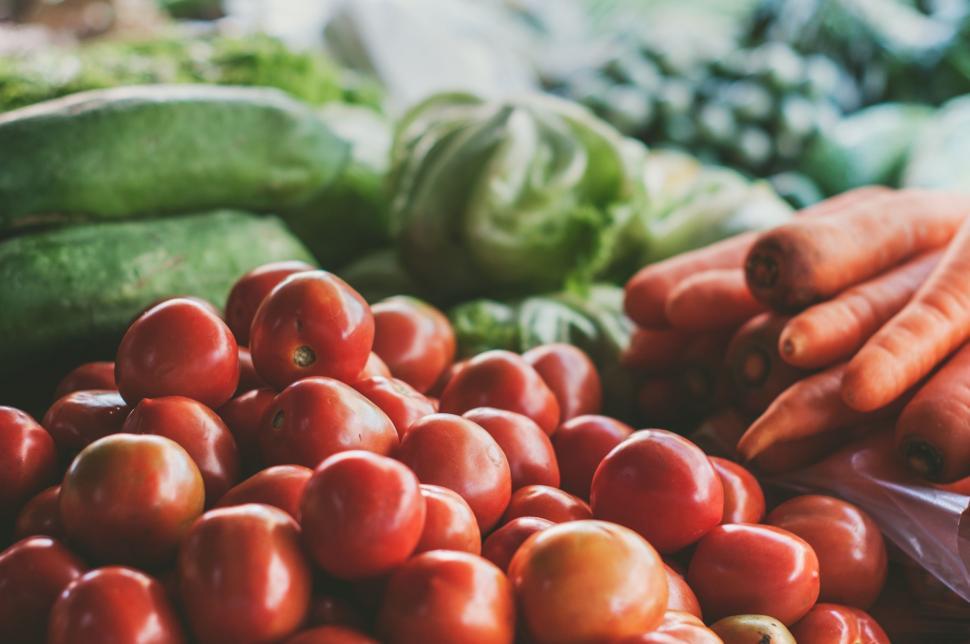 Free Image of Close Up of Tomatoes and Cucumbers on a Table 