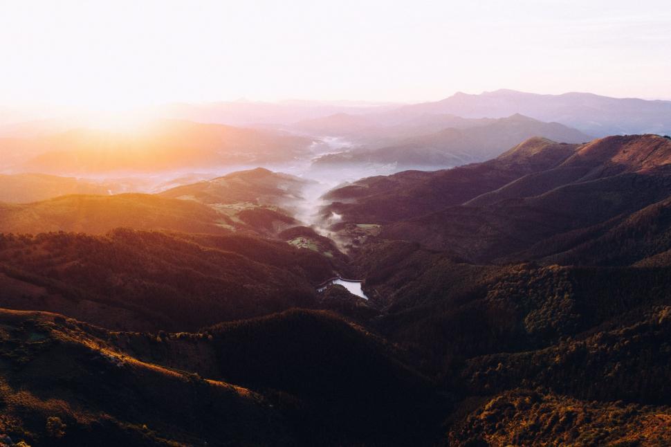 Free Image of Majestic Mountain Range Silhouetted by Sunset 
