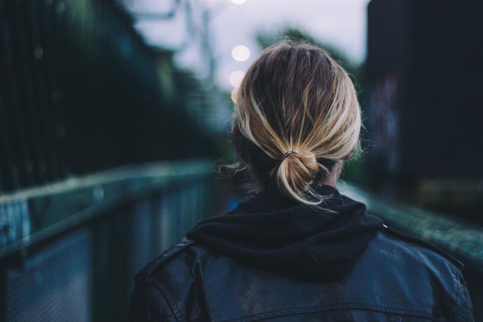 Free Image of Woman Standing on Bridge 