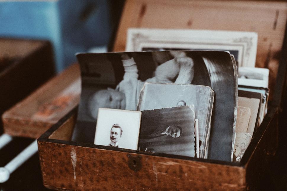Free Image of Wooden Box Filled With Photos and Picture. 