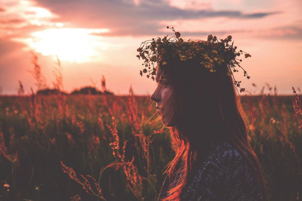 Free Image of Woman Standing in a Field of Tall Grass 