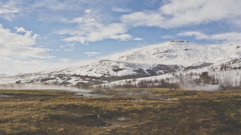 Free Image of Man Riding Snowboard Down Snow-Covered Slope 