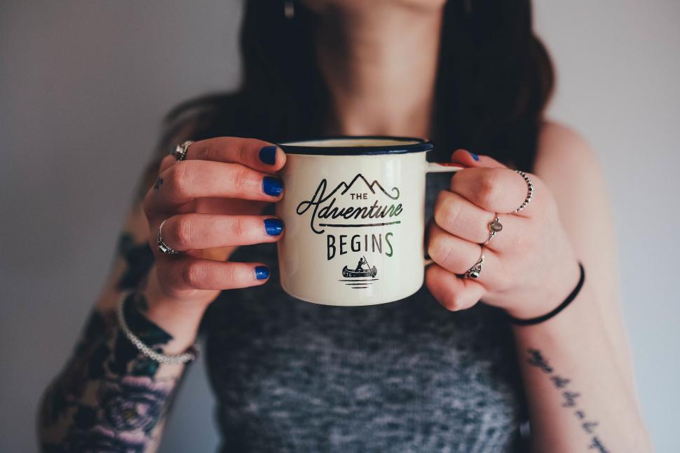 Free Image of Woman Holding a Coffee Mug 