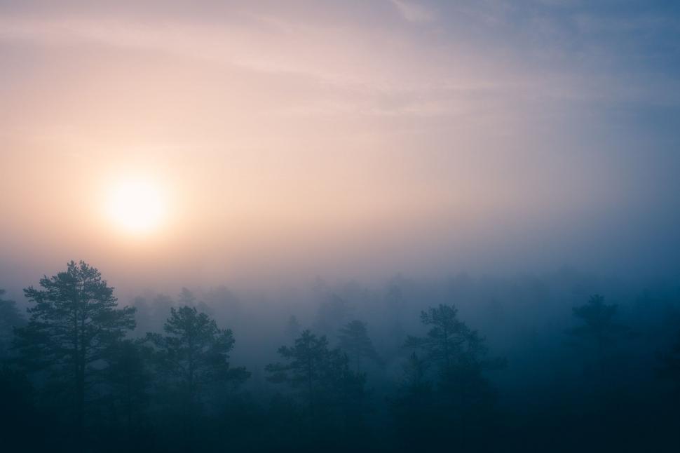 Free Image of Sun Shining Through Clouds in the Sky 