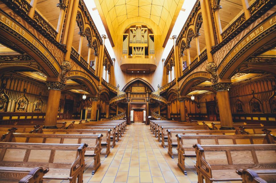 Free Image of Church Interior With Pews and Wall Clock 