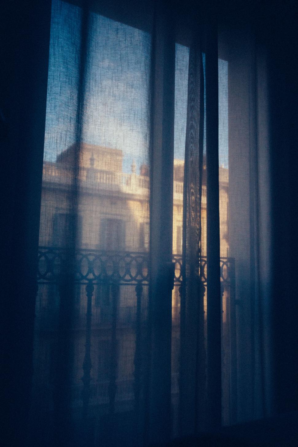 Free Image of City Building Seen Through Window 