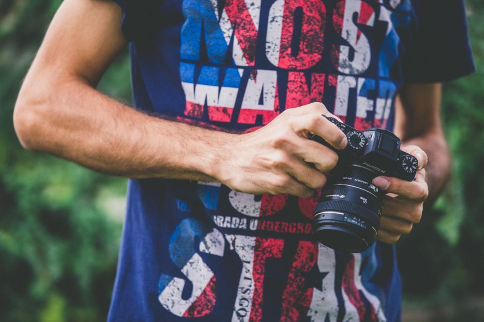 Free Image of Man Holding Camera 