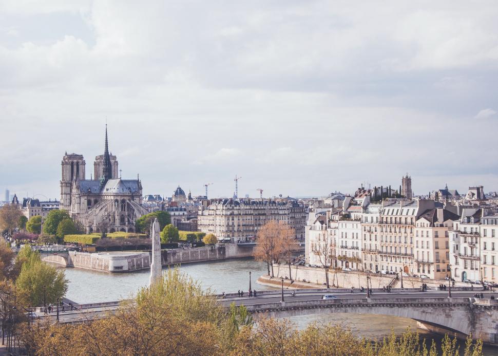 Free Image of River Running Through City Next to Tall Buildings 