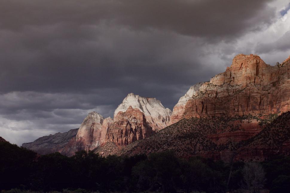 Free Image of Mountain Range Under Cloudy Sky 