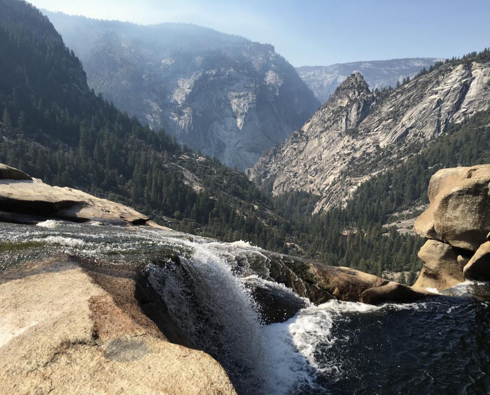 Free Image of River Flowing Through Valley Surrounded by Mountains 