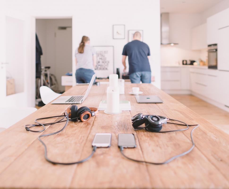 Free Image of Two Laptops and Headphones on a Table 
