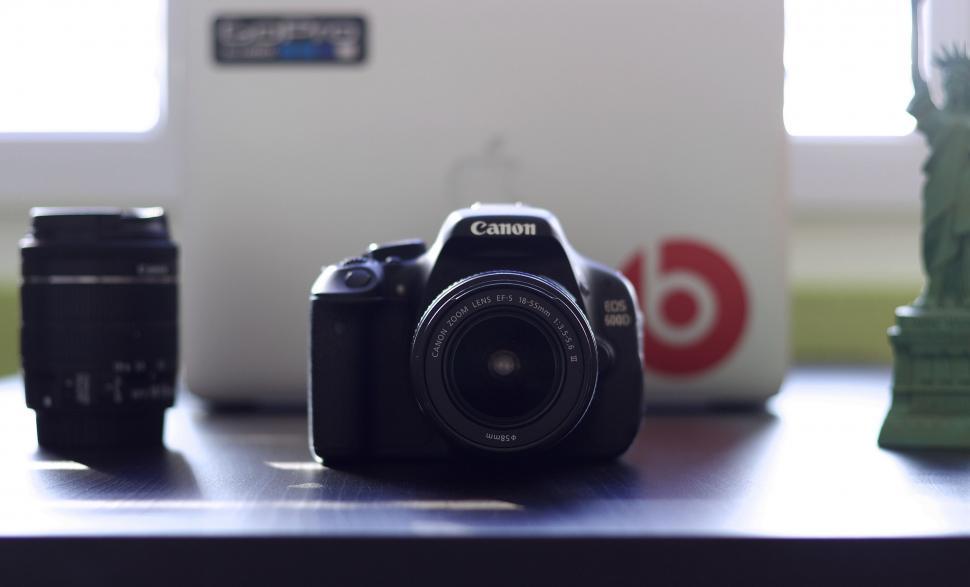 Free Image of Camera and Laptop on Table 
