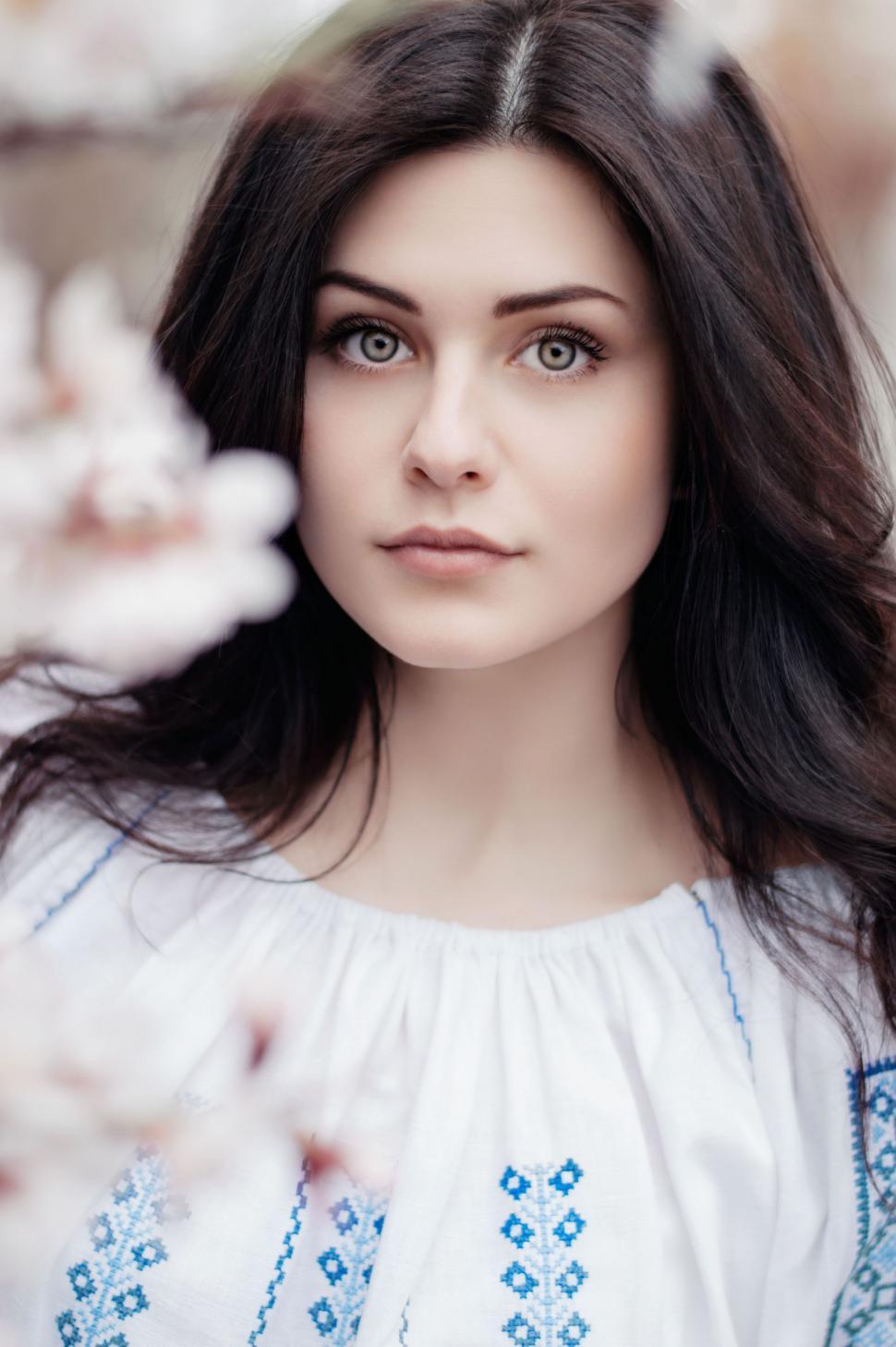 Free Image of Woman in White Dress Posing for Picture 