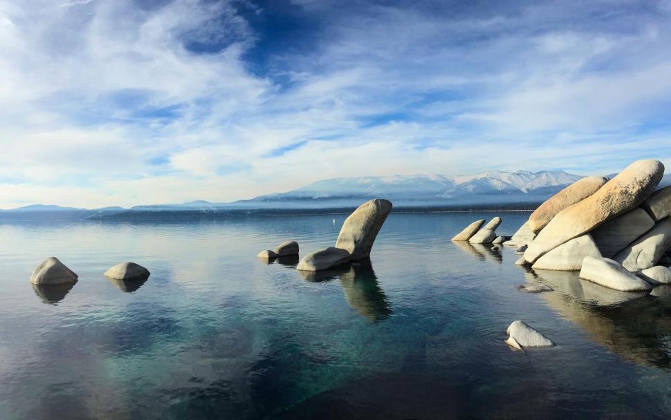 Free Image of Rocky Waterfront by a Large Body of Water 