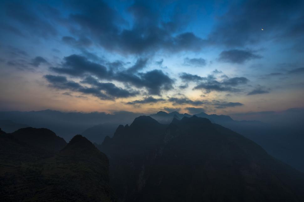 Free Image of Majestic Mountain Range Under Cloudy Sky 