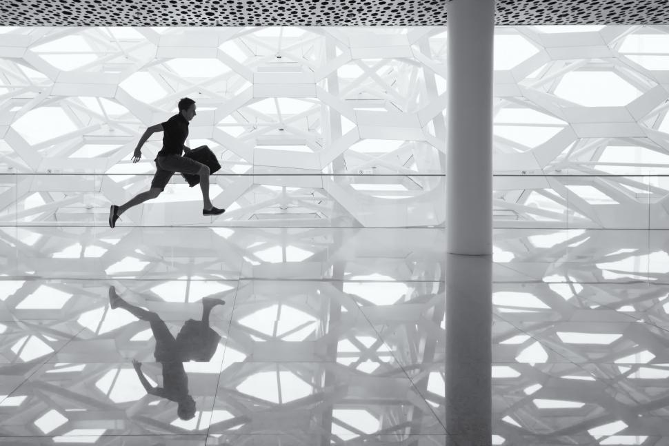 Free Image of Man Running Through Building 