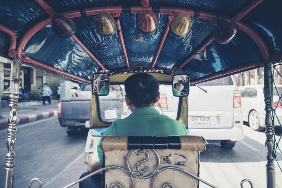 Free Image of Man Driving Bus Down City Street 