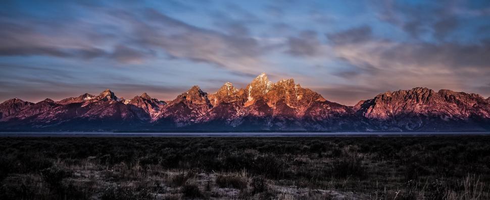 Free Image of Majestic Mountain Range Under Cloudy Sky 