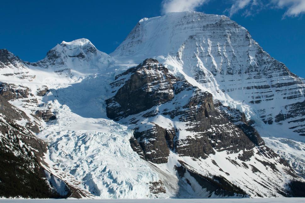Free Image of Majestic Snow-Covered Mountain Under Blue Sky 