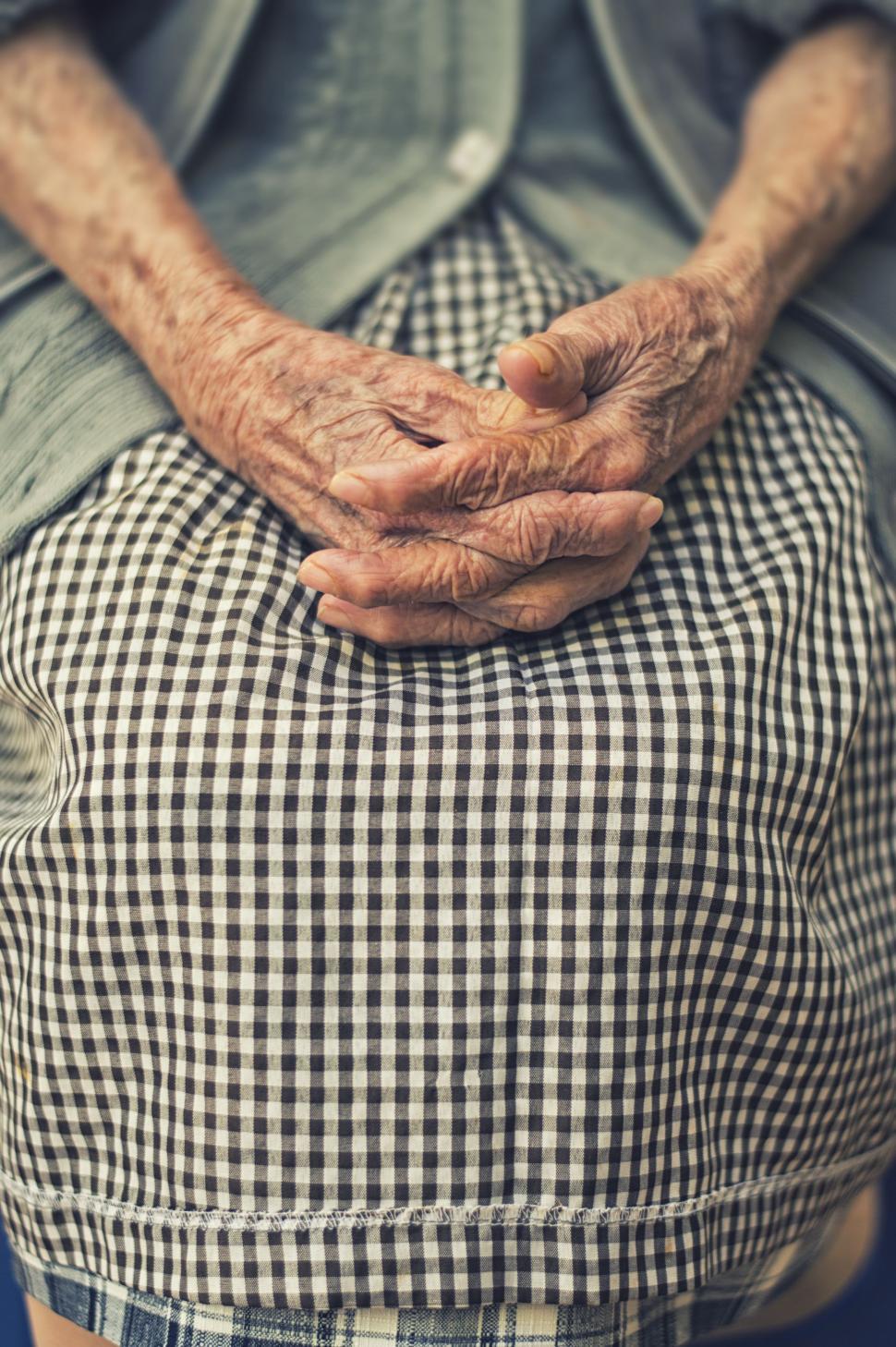 Free Image of Person Standing With Hands on Their Back 