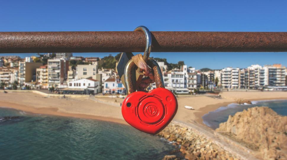 Free Image of Red Padlock Secured on Metal Railing 