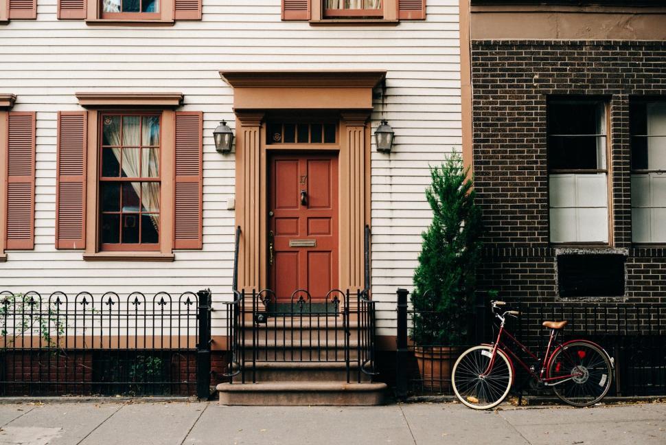 Free Image of Bicycle Parked in Front of White House 