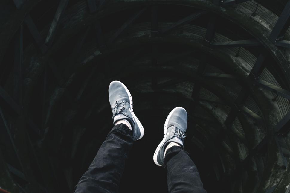Free Image of Person Standing in the Middle of a Tunnel 