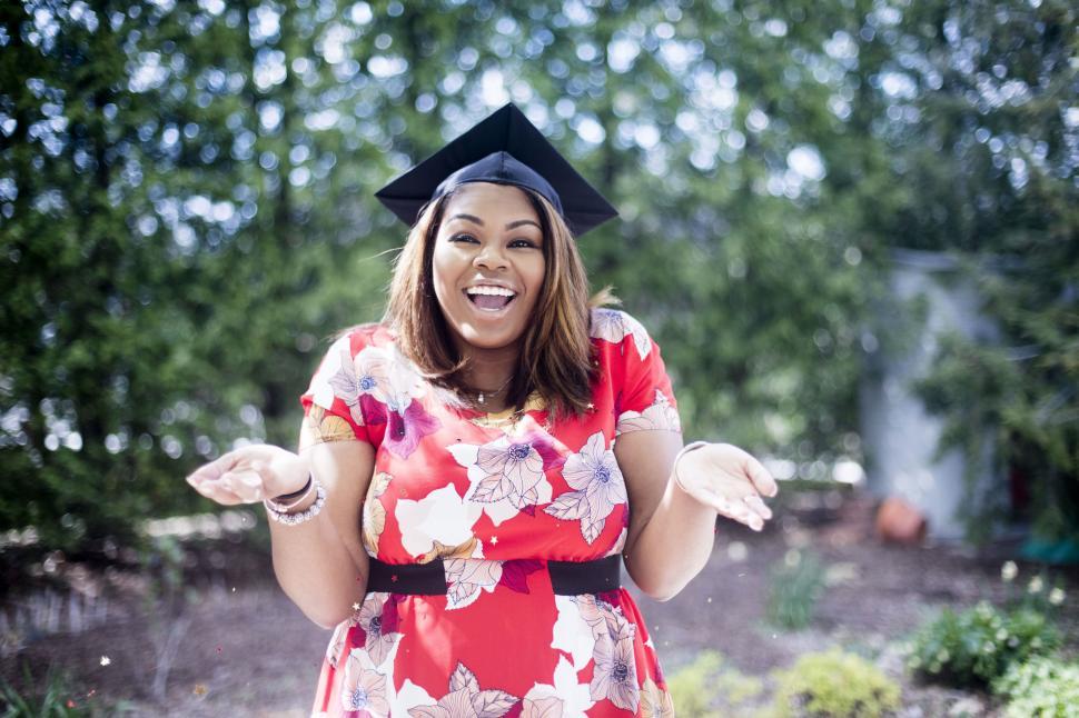Free Image of Woman Wearing Graduation Cap and Gown 
