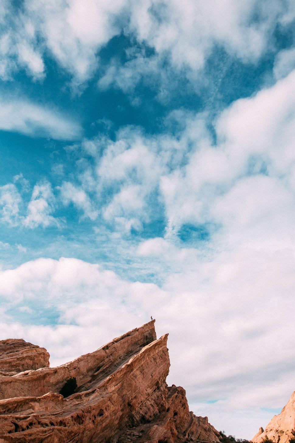 Free Image of Man Surfing on Sandy Beach 