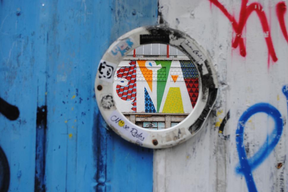 Free Image of Close up of a Door With Graffiti 