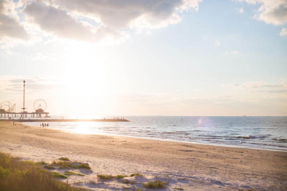 Free Image of Sandy Beach With a Ferris Wheel 