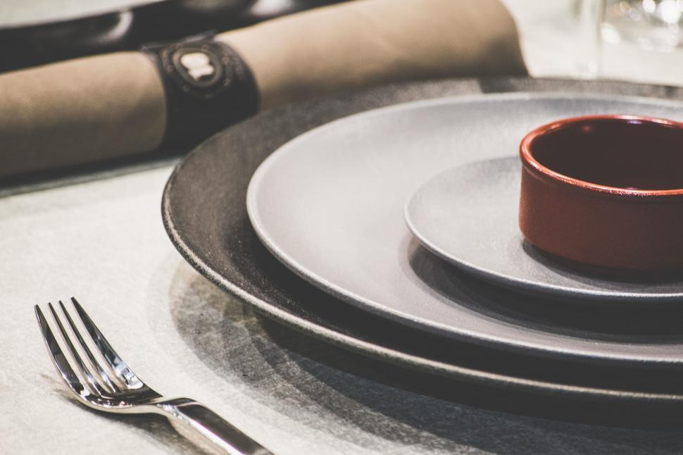 Free Image of Black Plate With Red Bowl 