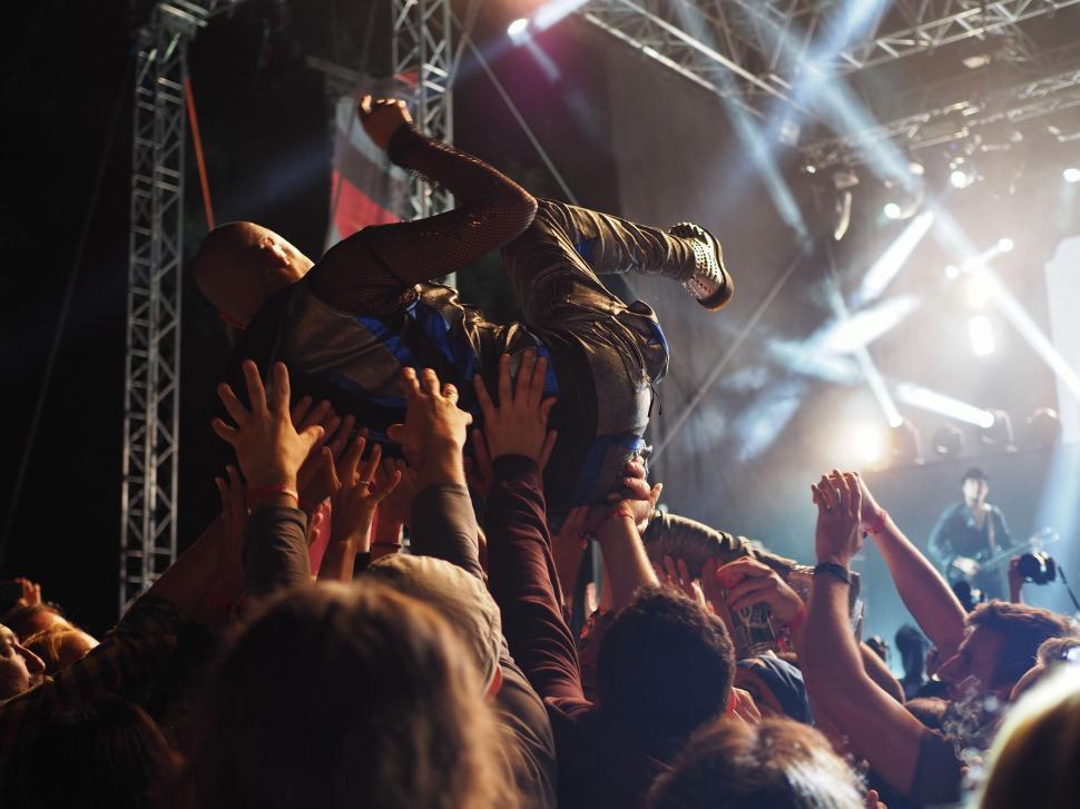 Free Image of Energetic Crowd at Concert Raising Hands 