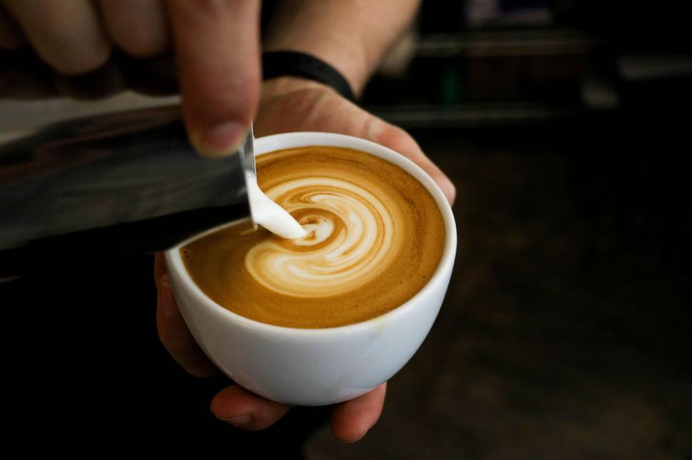 Free Image of Person Holding Cup of Coffee With Spoon 