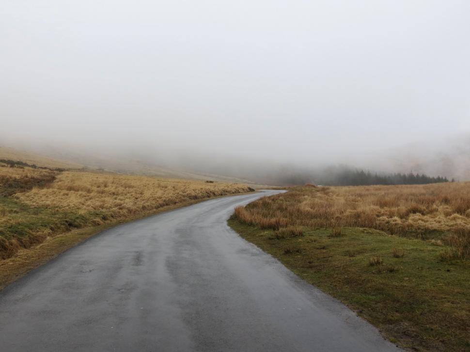 Free Image of Empty Road Cutting Through Field 