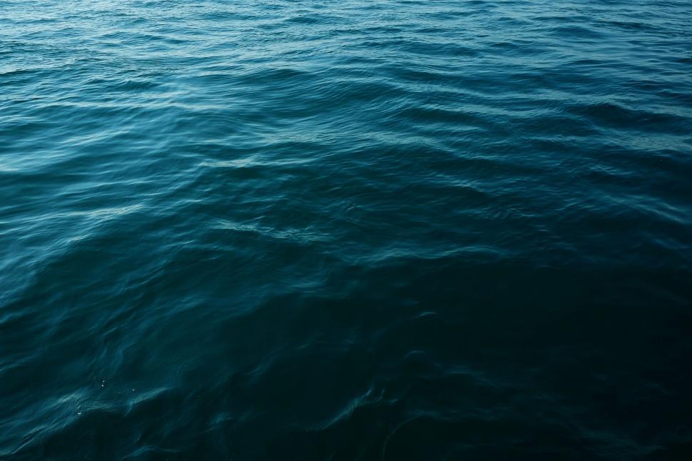 Free Image of Boat Sailing Across Vast Ocean 