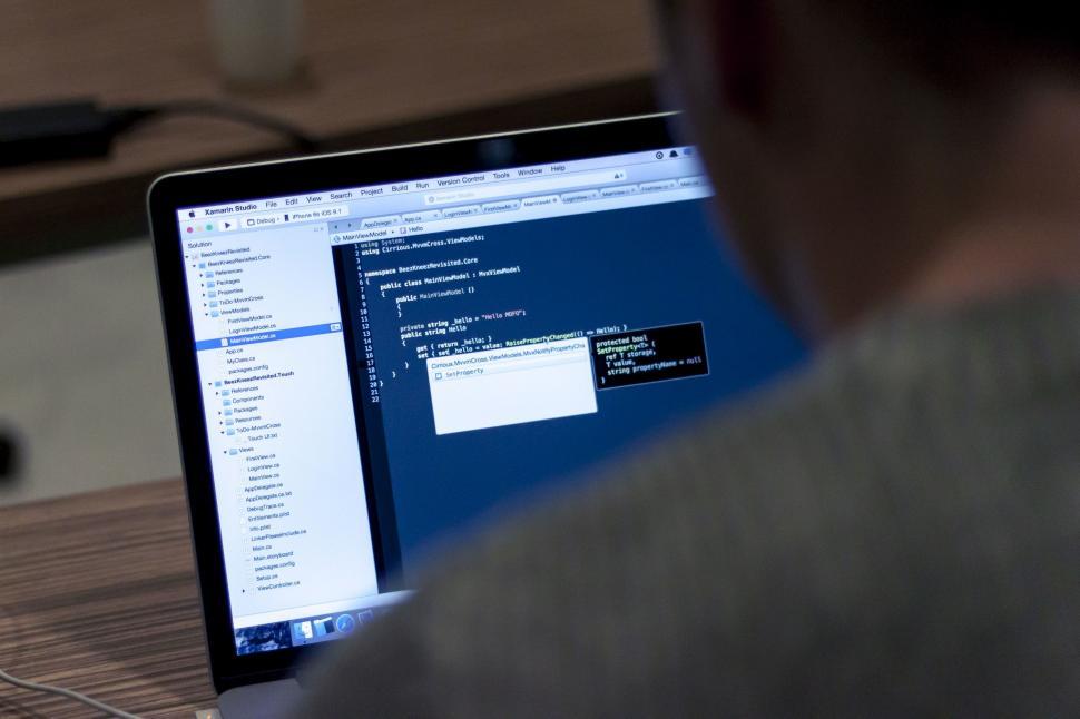 Free Image of Man Sitting in Front of Laptop Computer 