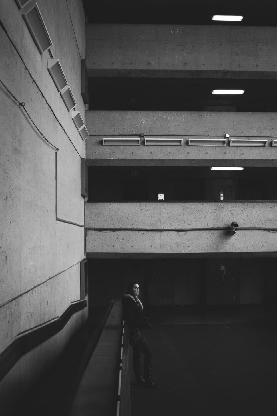 Free Image of Man Walking in Parking Garage 